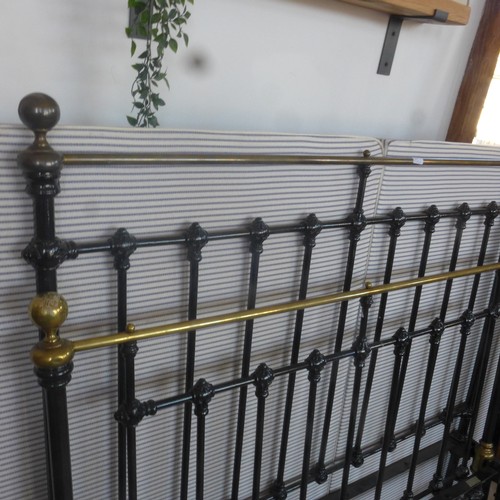 529A - A 19th century brass and iron double bed - 4ft 6in wide with a base and irons - in good condition