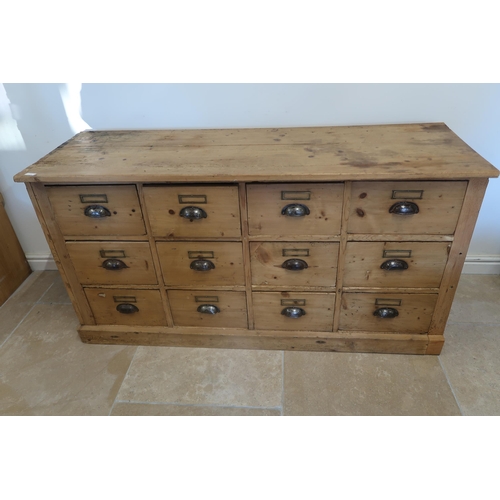 598 - A Continental pine 12 drawer chest of drawers - Width 147cm x Height 77cm