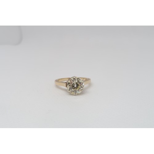 1A - An impressive 2.10ct diamond solitaire ring - The old brilliant cut diamond set in 14ct yellow gold ... 