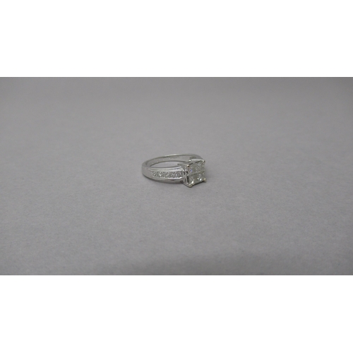 145 - An 18ct white gold and diamond ring - Four central square cut diamonds each approx 0.15-0.2ct - shou... 