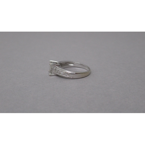 145 - An 18ct white gold and diamond ring - Four central square cut diamonds each approx 0.15-0.2ct - shou... 