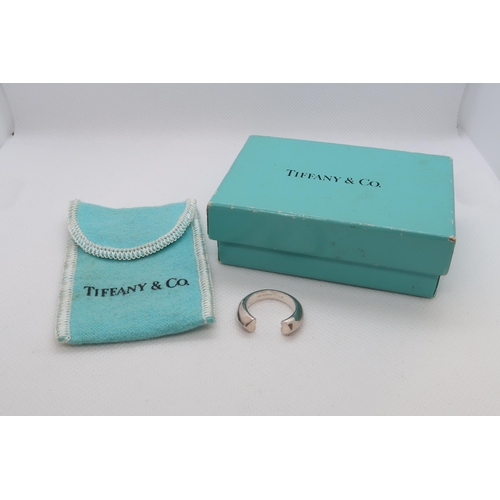 109 - A Tiffany & Co Sterling Silver open ring size J - with box and bag