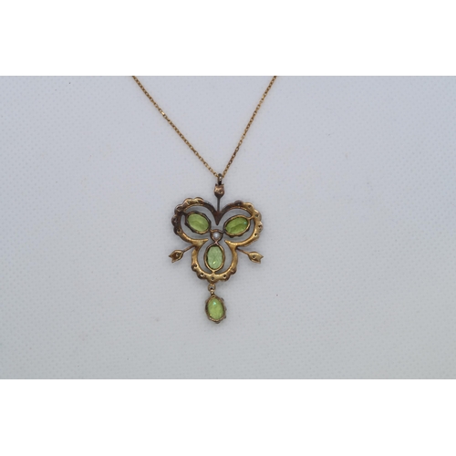 111 - A 9ct yellow gold and silver vintage style necklace set with peridots, diamonds and a seed pearl, bo... 