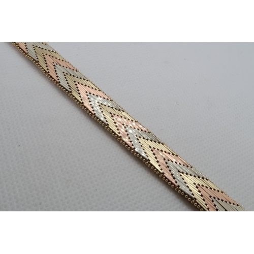 141 - A 14ct (hallmarked) tri colour gold bracelet - approx 18cm - weight approx 36.2 grams