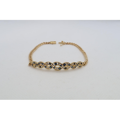 143 - An 18ct (hallmarked) yellow gold bracelet with blue sapphires and diamonds - 17cm - approx weight 8.... 