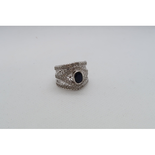 148 - A 14ct white gold (hallmarked) ring with diamonds and spinel - ring size N - approx weight 6.7 grams