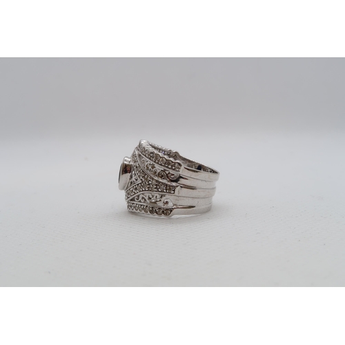 148 - A 14ct white gold (hallmarked) ring with diamonds and spinel - ring size N - approx weight 6.7 grams