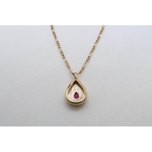 158 - An 18ct yellow gold (hallmarked) pendant on chain - Drop shaped and set with ruby and diamond accent... 