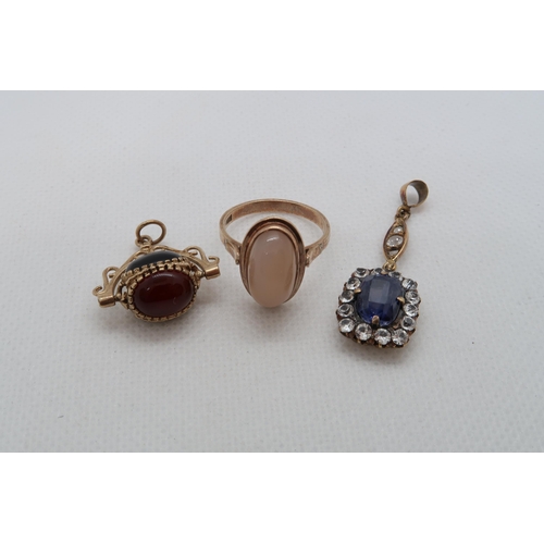 164 - A gold (tested) and sapphire drop pendant 3.5cm, a 9ct (hallmarked) swivel fob and a 9ct (hallmarked... 