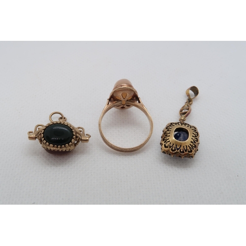 164 - A gold (tested) and sapphire drop pendant 3.5cm, a 9ct (hallmarked) swivel fob and a 9ct (hallmarked... 