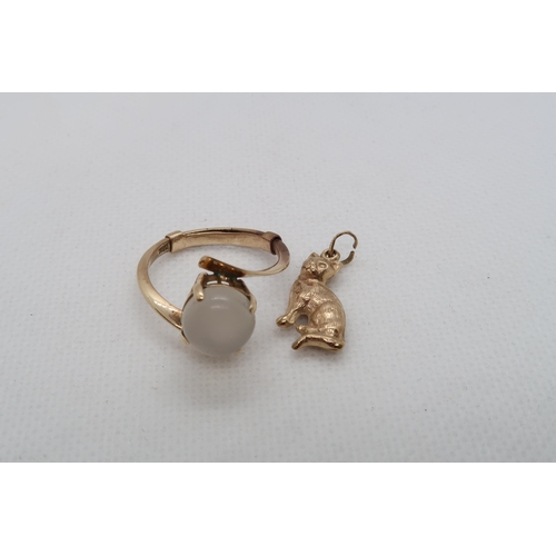 170 - An 18ct yellow gold (hallmarked) and moonstone ring size R with a 9ct yellow gold (hallmarked) charm... 