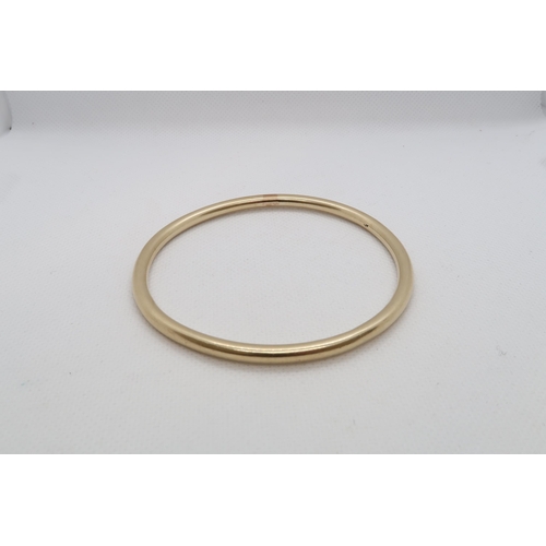 176 - A 9ct yellow gold (hallmarked) bangle - Diameter 7.5cm - weight approx 34.1 grams