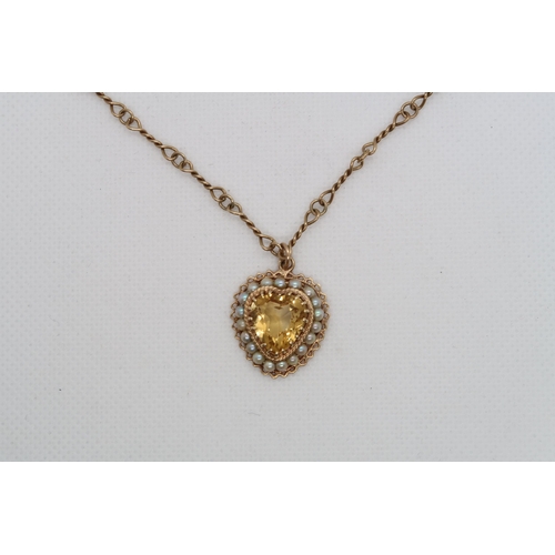 180 - A 14k yellow gold (hallmarked) heart pendant with citrine and pearls approx 2cm - on yellow gold cha... 