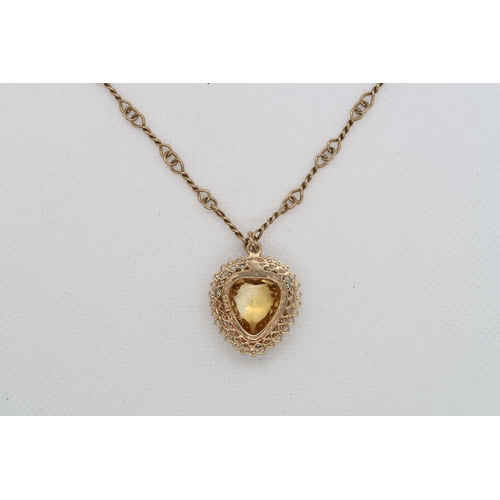 180 - A 14k yellow gold (hallmarked) heart pendant with citrine and pearls approx 2cm - on yellow gold cha... 