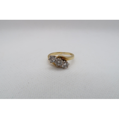 181 - An 18ct yellow gold (hallmarked) three stone diamond ring -total round brilliant cut diamond weight ... 