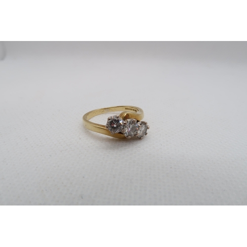 181 - An 18ct yellow gold (hallmarked) three stone diamond ring -total round brilliant cut diamond weight ... 