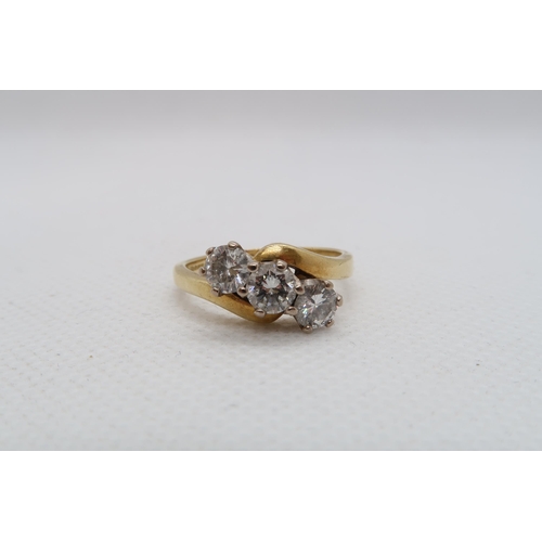 181 - An 18ct yellow gold (hallmarked) three stone diamond ring -total round brilliant cut diamond weight ... 