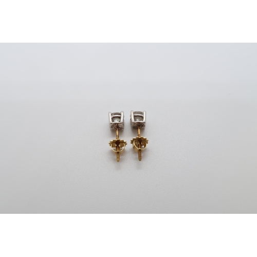 182 - A pair of single stone diamond stud earrings - studs set in 18ct white gold with 18ct yellow gold sc... 