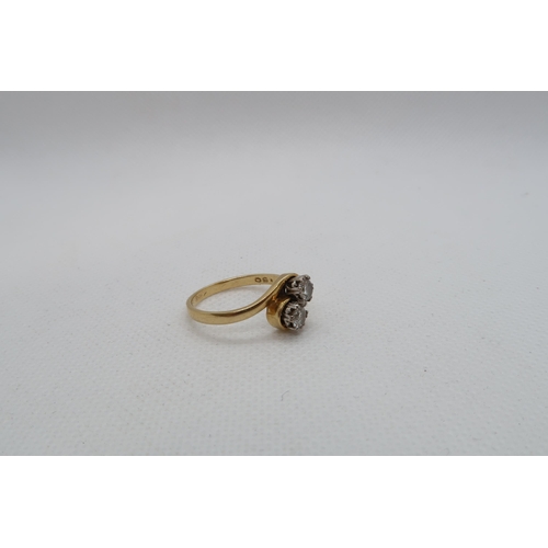 183 - An 18ct yellow gold (hallmarked) diamond two stone crossover ring - round brilliant cut diamonds, to... 