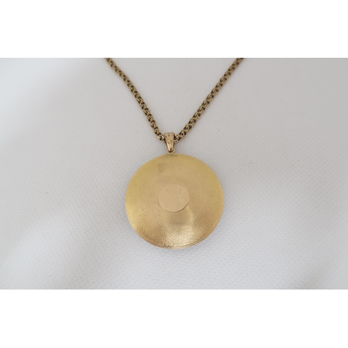 188 - An approx 9ct yellow gold (tested) and enamel frame pendant - approx 3.5cm diameter with frame and r... 