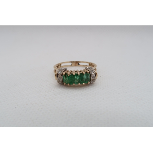 190 - A 14ct yellow gold (hallmarked) emerald ring with diamonds - ring size P - approx weight 3.8 grams