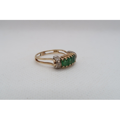 190 - A 14ct yellow gold (hallmarked) emerald ring with diamonds - ring size P - approx weight 3.8 grams