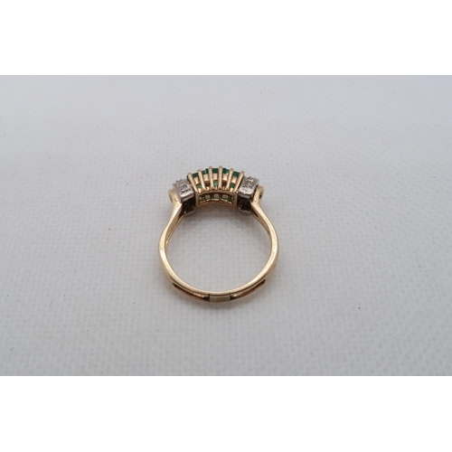 190 - A 14ct yellow gold (hallmarked) emerald ring with diamonds - ring size P - approx weight 3.8 grams