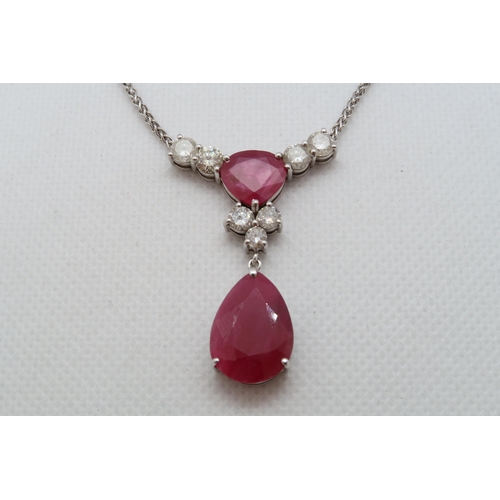 192 - A 9ct white gold (hallmarked) diamond and ruby drop necklace - total diamond weight approx 1.7ct - t... 