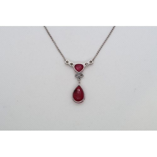 192 - A 9ct white gold (hallmarked) diamond and ruby drop necklace - total diamond weight approx 1.7ct - t... 