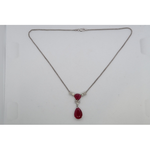 192 - A 9ct white gold (hallmarked) diamond and ruby drop necklace - total diamond weight approx 1.7ct - t... 