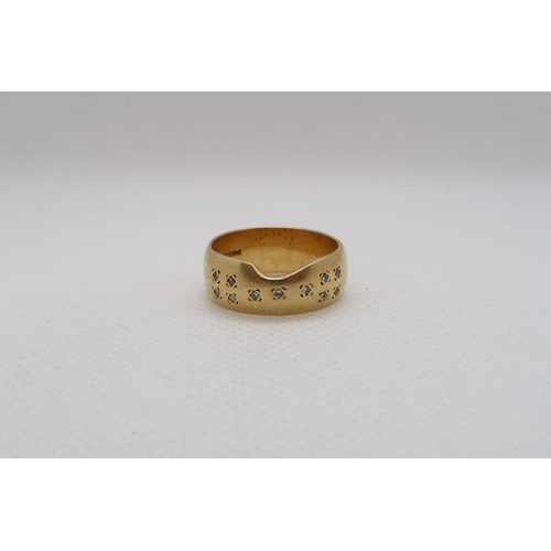 193 - An 18ct yellow gold (hallmarked) band with diamond accents - ring size Q - weight approx 8.7 grams