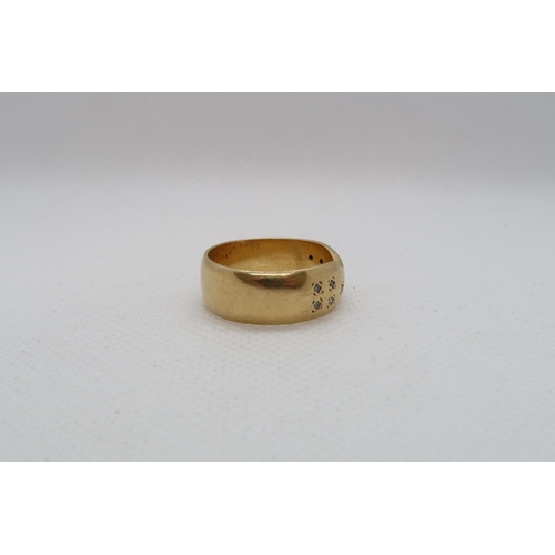 193 - An 18ct yellow gold (hallmarked) band with diamond accents - ring size Q - weight approx 8.7 grams