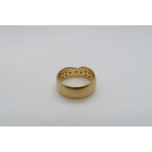 193 - An 18ct yellow gold (hallmarked) band with diamond accents - ring size Q - weight approx 8.7 grams