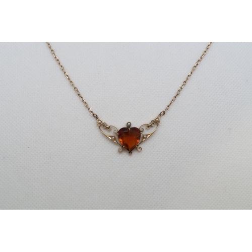 194 - An Edwardian 9ct (hallmarked) necklace with amber heart and seed pearls, pendant length approx 3.5cm... 