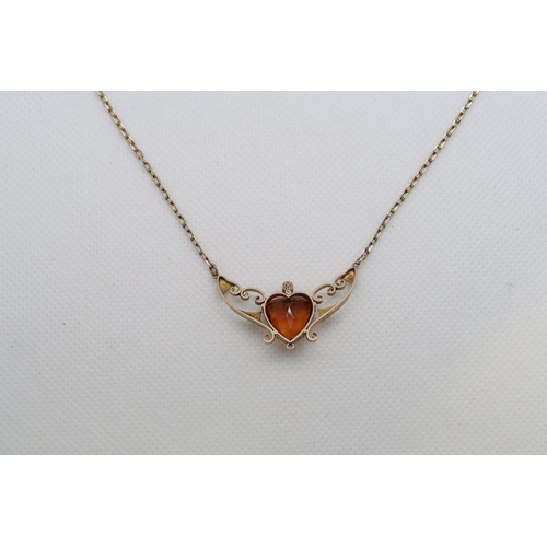 194 - An Edwardian 9ct (hallmarked) necklace with amber heart and seed pearls, pendant length approx 3.5cm... 