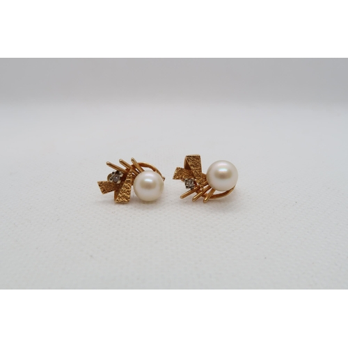 195 - A pair of Continental 18ct yellow gold (hallmarked) earrings with single pearl and diamond accent - ... 