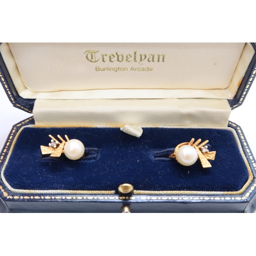 195 - A pair of Continental 18ct yellow gold (hallmarked) earrings with single pearl and diamond accent - ... 