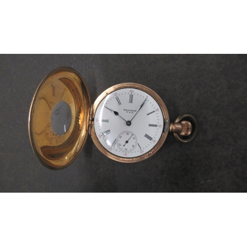 252 - A Waltham gold plated half hunter pocket watch - case approx 5cm - working in the saleroom