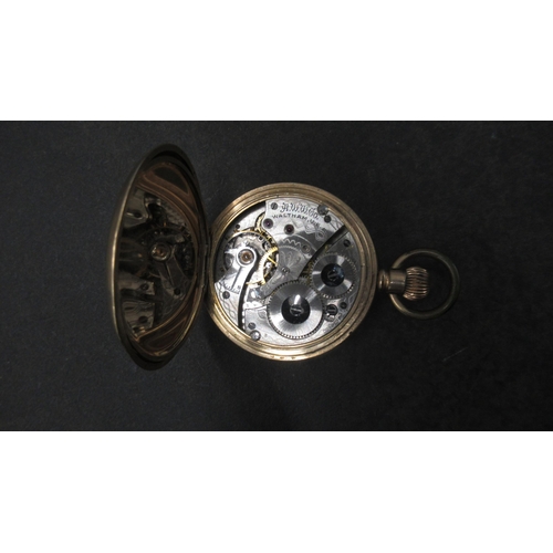 252 - A Waltham gold plated half hunter pocket watch - case approx 5cm - working in the saleroom