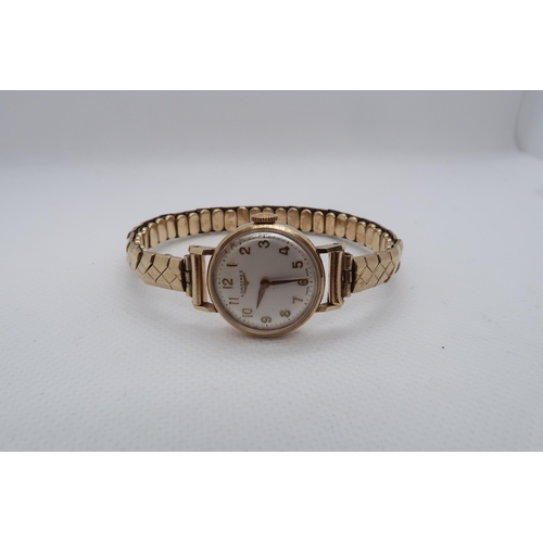 271 - A Longines 9ct yellow gold hallmarked ladies wristwatch on 9ct strap - round case 21mm - working in ... 