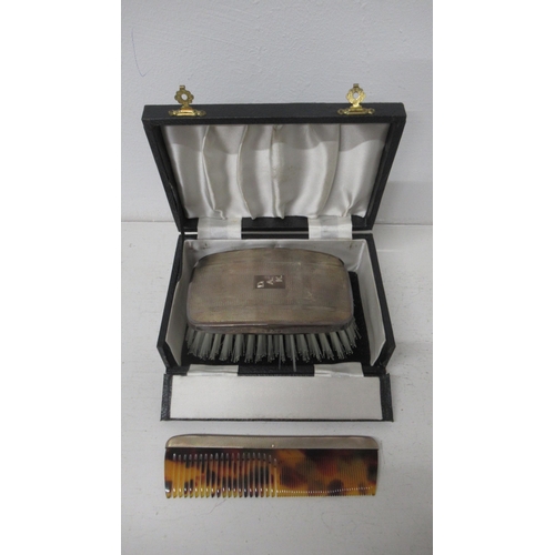 297 - A gents silver mounted two piece grooming set with brush and comb - Birmingham 1956 - in a fitted ca... 