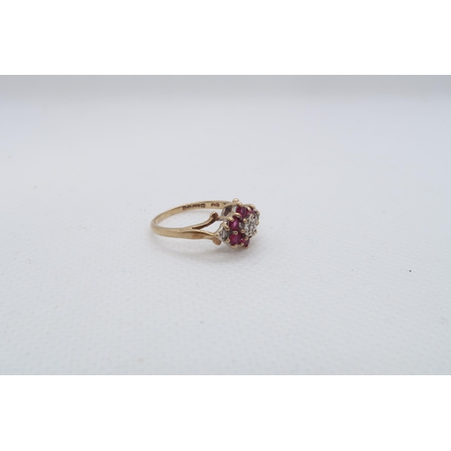 32 - A 9ct yellow gold (hallmarked) ruby and diamond cluster ring size I/J - approx weight 1.8 grams