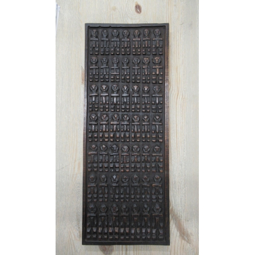 355 - A Mali Dogon carved wood panel - 71cm x 27cm