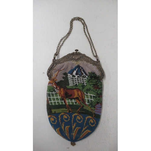 359 - A beaded reticule with silver plated frame with stag and hunting scene - clasp working - 21cm x 13cm