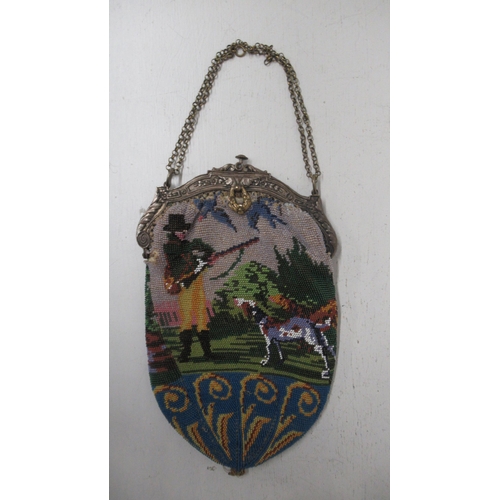 359 - A beaded reticule with silver plated frame with stag and hunting scene - clasp working - 21cm x 13cm