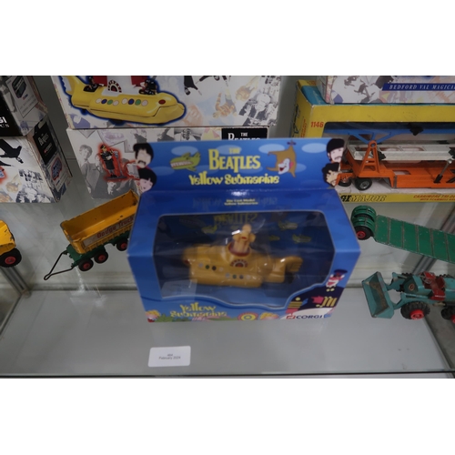 464 - Seven boxed Beatles Corgi models including Yellow Submarine, a Corgi Major transporter - all as new ... 