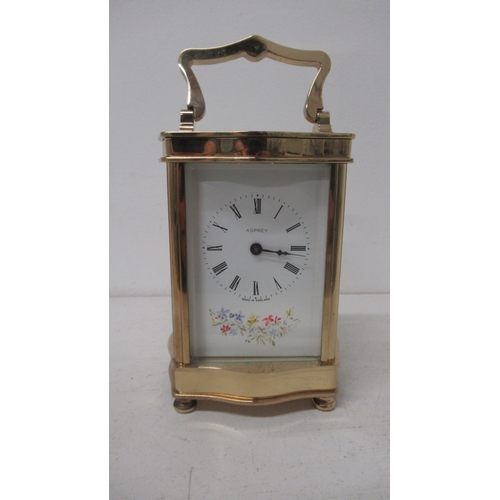 501 - An Asprey serpentine case brass carriage clock with hand painted dial - working, with key - approx h... 