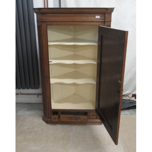 502 - An oak corner cupboard - 122cm x 76cm