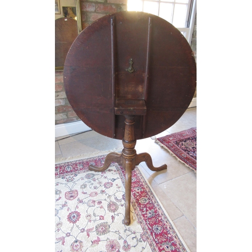 518 - A 19th century oak tripod table - top diameter 86cm