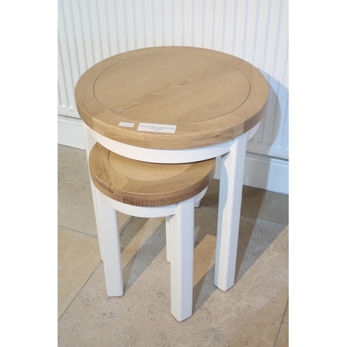 548 - Winchester 2 round nest of tables. Painted white. Ex display